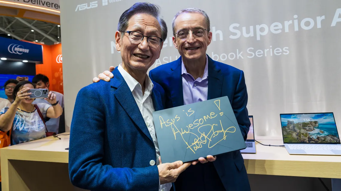 3. Asus Chairman Jonney Shih and Intel Ceo Pat Gelsinger Hold up an Asus Zenbook Duo Signed by Gelsinger.